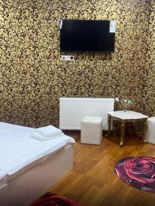 Postel nebo postele na pokoji v ubytování Giorgia hotel + 2 fotografie