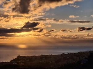 a view of a city with the sun setting at Dal Moro 44 in Moglie