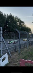 a race track with two cars on the track at chambre sur le circuit des 24h du Mans in Ruaudin