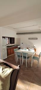 a kitchen with a table and chairs in a room at Pax Costa del Este in Costa del Este