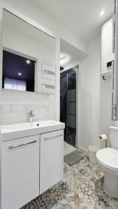 Et badeværelse på Suite Plum - Centre Ville