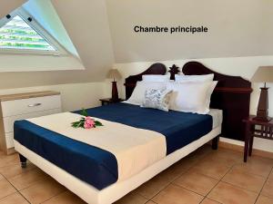 Ένα ή περισσότερα κρεβάτια σε δωμάτιο στο T3 Passion Tropiques Sainte-Luce vue mer et piscine +38 φωτογραφίες