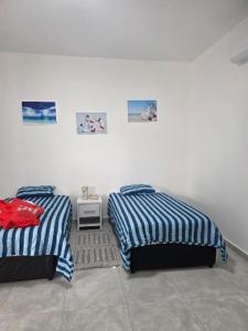 Una cama o camas en una habitación de aylana Village