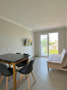 Et opholdsområde på Apê Aconchego - Capri Morada & Mar - Lateral Mar