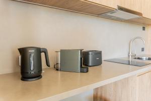 Kuchyň nebo kuchyňský kout v ubytování CasaChica Hotel