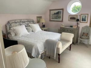 Ένα ή περισσότερα κρεβάτια σε δωμάτιο στο Elegant Cotswold Retreat