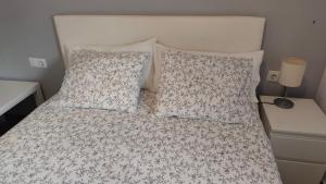 Ένα ή περισσότερα κρεβάτια σε δωμάτιο στο BNB LOLA - Habitacion privada - Aire acondicionado - Baños compartidos