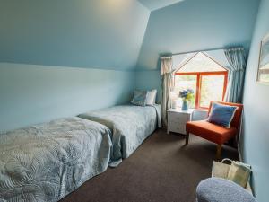 Ένα ή περισσότερα κρεβάτια σε δωμάτιο στο Seaview Akaroa +55 φωτογραφίες