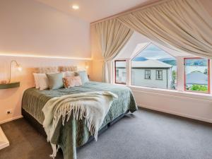 Ένα ή περισσότερα κρεβάτια σε δωμάτιο στο Seaview Akaroa