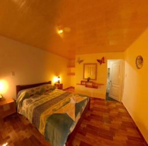 Giường trong phòng chung tại Pueblito Quindiano