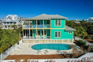 an aerial view of a house with a pool at Surfer Dog l Beachfront Pool l Includes Beach Chairs and Bikes in Inlet Beach