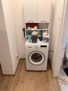 a washer and dryer in a small room at Ru apartment in Craiova