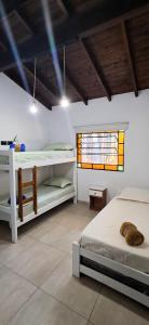 a bedroom with two bunk beds and a window at Pax Costa del Este in Costa del Este
