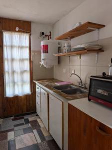 Kuchyň nebo kuchyňský kout v ubytování Departamento Las Lavandas