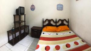 Ένα ή περισσότερα κρεβάτια σε δωμάτιο στο Hospedaje Maluli 07