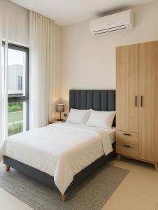 Ένα ή περισσότερα κρεβάτια σε δωμάτιο στο Splendid Mountains View Three Bedroom Apartment +13 φωτογραφίες