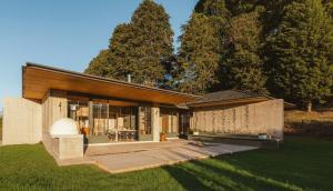 a large house with a large patio in a yard at Summit Escape Peace & Comfort in Cartago