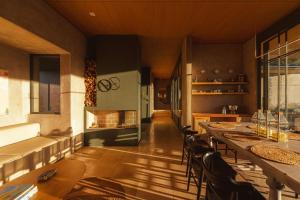 a kitchen with a long table and chairs at Summit Escape Peace & Comfort in Cartago