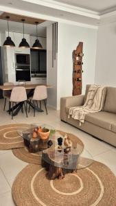 a living room with a table and a couch at kriola Breeze in Praia
