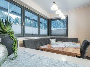 a living room with a couch and a table at APART Naturcamping Kuprian in Längenfeld