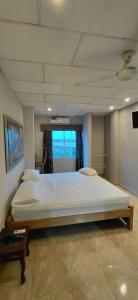 Ένα ή περισσότερα κρεβάτια σε δωμάτιο στο siempre hotel