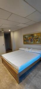 Ένα ή περισσότερα κρεβάτια σε δωμάτιο στο siempre hotel