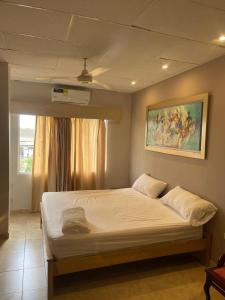 Ένα ή περισσότερα κρεβάτια σε δωμάτιο στο siempre hotel