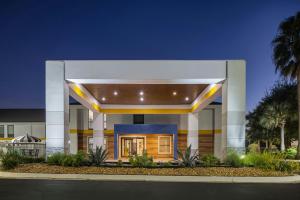 a large building with a lit up facade at City Express by Marriott Yulee in Yulee