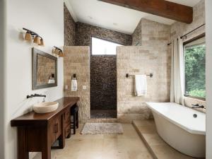 a bathroom with a tub and a sink and a shower at Private Resort in Lake Hodges in Escondido