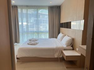 Ένα ή περισσότερα κρεβάτια σε δωμάτιο στο Royal Kamala - 1 separated bedroom Condo +16 φωτογραφίες