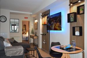 Μια τηλεόραση ή/και κέντρο ψυχαγωγίας στο Alojamiento El Rincón de Rosa +21 φωτογραφίες