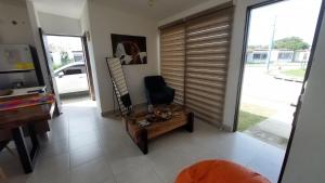 a living room with a desk and a chair at Río Hato in El Chirú