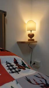 Ένα ή περισσότερα κρεβάτια σε δωμάτιο στο Il Mughetto