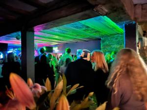 a group of people standing in a room at a party at The Balnoon Inn B&B in St Ives