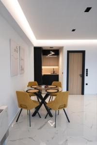 a dining room with a table and chairs at You and the view in Mytilene
