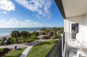 a balcony with a view of the ocean at Ocean Escape Boardwalk Oceanfront in Myrtle Beach