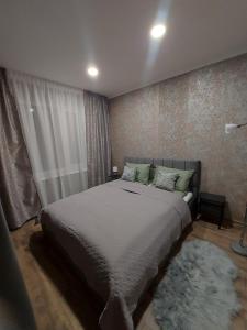 Ένα ή περισσότερα κρεβάτια σε δωμάτιο στο Goldi