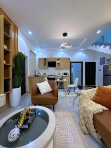 a large living room with a couch and a living room at Chevy Chase Gardens, 9 in East Legon