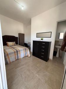 Postel nebo postele na pokoji v ubytování Las Flores en Quinta La Chata