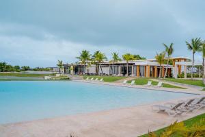 a swimming pool in front of a resort at Casa Luma Vistacana in Pueblo Bavaro