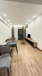 Un televizor și/sau centru de divertisment la Luxor Collection Apartments