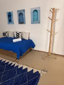 a room with two beds and a tree in it at Villa Léa in Marrakesh +34 photos