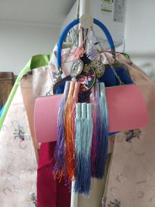 a hanger with tassels hanging from a dummy at Romantic Winter Package , K-Culture Experience Itaewon 7min,2F Korean Culture Zone ,Terrace , K-Ramen Challenge in Seoul