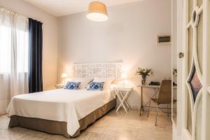 Un ou plusieurs lits dans un hébergement de l'établissement Hotel Boutique Casa de Colón