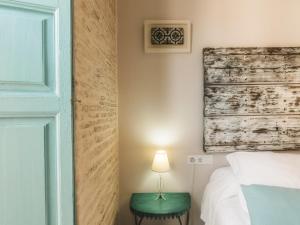 Un ou plusieurs lits dans un hébergement de l'établissement Hotel Boutique Casa de Colón