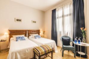 Un ou plusieurs lits dans un hébergement de l'établissement Hotel Boutique Casa de Colón