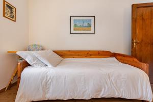 Ένα ή περισσότερα κρεβάτια σε δωμάτιο στο Casa Ai tre cavalli vista sulle Dolomiti +16 φωτογραφίες