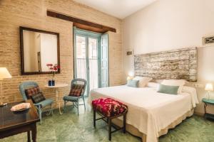 Un ou plusieurs lits dans un hébergement de l'établissement Hotel Boutique Casa de Colón