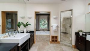 a bathroom with a large sink and a shower at The Castle Rock Estate by AvantStay Steps From Arch Cape beach w Hot Tub Sauna in Arch Cape +55 photos