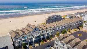 an aerial view of a beach with buildings and the ocean at Moonlight by AvantStay Modern Home w Views Direct Access to Rockaway Beach in Rockaway Beach